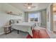 Well-lit bedroom featuring a ceiling fan, neutral colors, and a bright window at 23957 E Rocky Top Ave, Aurora, CO 80016