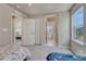 Bedroom featuring neutral walls, carpet, and access to an ensuite bathroom and an additional bedroom at 23957 E Rocky Top Ave, Aurora, CO 80016