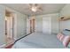 Comfortable bedroom features a ceiling fan and neutral colors at 23957 E Rocky Top Ave, Aurora, CO 80016