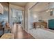 Inviting foyer with hardwood floors and views into the dining and living spaces at 23957 E Rocky Top Ave, Aurora, CO 80016