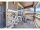 Charming front porch with stone accents and seating area at 23957 E Rocky Top Ave, Aurora, CO 80016