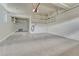 Spacious garage with epoxy flooring and built-in shelving for ample storage space at 23957 E Rocky Top Ave, Aurora, CO 80016