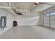 Clean and spacious garage with ample storage shelving at 23957 E Rocky Top Ave, Aurora, CO 80016