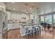 Stylish kitchen featuring a large island, stainless steel appliances, and a cozy eat-in dining area at 23957 E Rocky Top Ave, Aurora, CO 80016