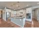 Modern kitchen featuring granite countertops, stainless steel appliances, and stylish pendant lighting at 23957 E Rocky Top Ave, Aurora, CO 80016