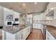 Modern kitchen features stainless steel appliances, granite countertops, and stylish pendant lighting at 23957 E Rocky Top Ave, Aurora, CO 80016