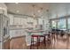 Bright, open kitchen featuring a large island with bar seating, modern appliances, and eat-in dining area at 23957 E Rocky Top Ave, Aurora, CO 80016