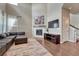 Cozy living room with fireplace and hardwood floors at 23957 E Rocky Top Ave, Aurora, CO 80016