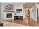 Cozy living room with fireplace and hardwood floors at 23957 E Rocky Top Ave, Aurora, CO 80016