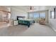 Serene main bedroom with large windows, ensuite bathroom, and neutral decor, creating a relaxing space at 23957 E Rocky Top Ave, Aurora, CO 80016
