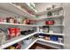 Walk-in pantry with lots of shelves, ample storage space, and hardwood floors at 23957 E Rocky Top Ave, Aurora, CO 80016