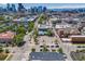 Wide aerial view of the property showcasing its location with mountain views and mature trees at 2801 Lawrence St, Denver, CO 80205