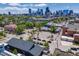 Wide aerial view of the property showcasing its location with city views and mature trees at 2801 Lawrence St, Denver, CO 80205