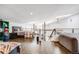 Open floorplan loft with a comfortable bed, hardwood floors, and cozy seating at 2801 Lawrence St, Denver, CO 80205