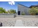 Modern home featuring a landscaped front yard with a secure fence and unique architectural design at 2801 Lawrence St, Denver, CO 80205