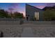 Modern home featuring a landscaped front yard with a secure fence and unique architectural design at 2801 Lawrence St, Denver, CO 80205