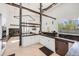 Bright, modern kitchen with white cabinets, dark countertops, and stainless steel appliances at 2801 Lawrence St, Denver, CO 80205