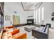 Bright living room features a modern fireplace, high ceilings, and comfortable seating at 2801 Lawrence St, Denver, CO 80205
