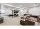Spacious basement with stairs, living room seating, and a bed for flexible living at 2801 Lawrence St, Denver, CO 80205