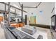 Open living space with steel beam construction, modern furnishings, and lots of natural light at 2801 Lawrence St, Denver, CO 80205