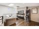 Upstairs living area features a flat screen television, game, and modern furnishings at 2801 Lawrence St, Denver, CO 80205