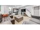 Basement living room with grey and leather couches, decor, and stairs at 2801 Lawrence St, Denver, CO 80205