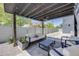 Outdoor patio with shade, seating, and decorative gravel at 2801 Lawrence St, Denver, CO 80205