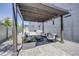 Cozy outdoor patio with modern furniture, pergola, and gravel landscaping at 2801 Lawrence St, Denver, CO 80205