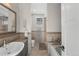 Clean bathroom, granite countertop, bathtub, and shower at 967 Country Club Pkwy, Castle Rock, CO 80108