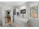 Bathroom features a freestanding soaking tub and fireplace at 967 Country Club Pkwy, Castle Rock, CO 80108