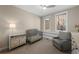 Bedroom with crib, chair, and built-in shelves at 967 Country Club Pkwy, Castle Rock, CO 80108