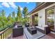 Relaxing deck with wooded views and comfortable seating at 967 Country Club Pkwy, Castle Rock, CO 80108