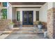 Elegant entryway with double doors and stone detailing at 967 Country Club Pkwy, Castle Rock, CO 80108