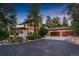 Stunning two-story home with a three-car garage and landscaped grounds at 967 Country Club Pkwy, Castle Rock, CO 80108