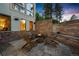 Cozy fire pit area with stone seating wall at 967 Country Club Pkwy, Castle Rock, CO 80108