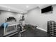 Home gym with treadmill, exercise bike, and weights at 967 Country Club Pkwy, Castle Rock, CO 80108