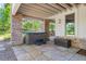 Covered patio with hot tub and brick columns at 967 Country Club Pkwy, Castle Rock, CO 80108