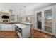Spacious kitchen boasts modern appliances and a large island, plus a fireplace and views at 967 Country Club Pkwy, Castle Rock, CO 80108