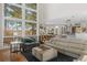 Relaxing living room with large windows, fireplace, and vaulted ceilings at 967 Country Club Pkwy, Castle Rock, CO 80108