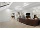 Open living area with fireplace, leather couches, and large TV at 967 Country Club Pkwy, Castle Rock, CO 80108