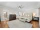 Main bedroom with large bed, dresser, and ensuite bathroom at 967 Country Club Pkwy, Castle Rock, CO 80108