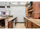 Stylish bar area with granite countertops, custom cabinetry, and a built-in sink is perfect for entertaining at 5375 Twilight Way, Parker, CO 80134