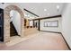 Basement bar features stone accents, pendant lighting, and ample space for seating and entertaining at 5375 Twilight Way, Parker, CO 80134