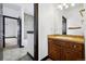 Hall bathroom with granite countertop, sink and framed mirror at 5375 Twilight Way, Parker, CO 80134
