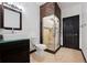 Modern bathroom showcasing a glass-enclosed shower, contemporary vanity, and elegant fixtures provides a serene retreat at 5375 Twilight Way, Parker, CO 80134