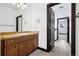 Bathroom featuring a vanity with a stone countertop, tile floors, and a separate hallway at 5375 Twilight Way, Parker, CO 80134
