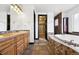 Spacious bathroom featuring a double sink vanity, soaking tub and walk-in closet at 5375 Twilight Way, Parker, CO 80134