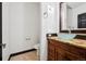Chic powder room features a vessel sink, granite countertop, and modern fixtures for a touch of elegance at 5375 Twilight Way, Parker, CO 80134