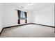 Clean bedroom with white walls, carpet flooring, and window with decorative curtains at 5375 Twilight Way, Parker, CO 80134