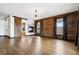 Open concept living room with hardwood floors, fireplace and natural light at 5375 Twilight Way, Parker, CO 80134